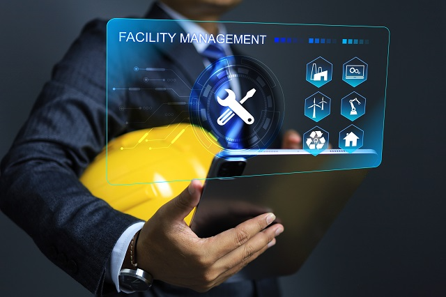 Facility management software app on tablet with feature icons