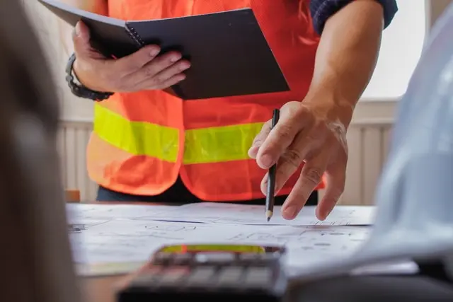 An engineer checking plans