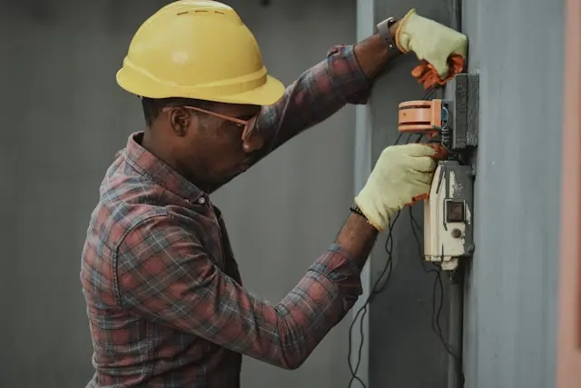 An engineer working on a wall