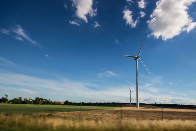 A modern, white windmill